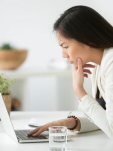 Woman reading about astrological events of 2022